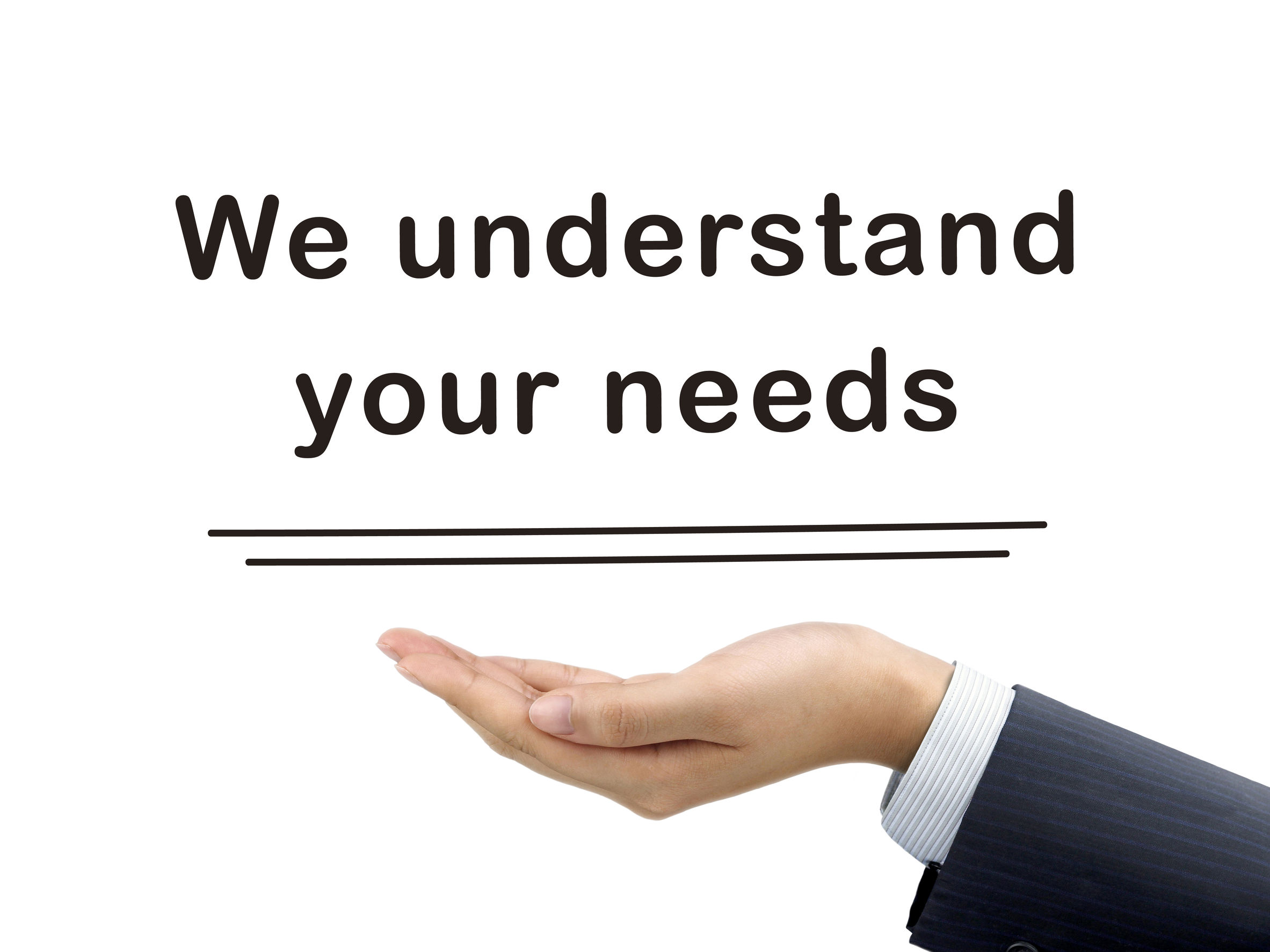 38749900 - we understand your needs holding by businessman's hand over white background
